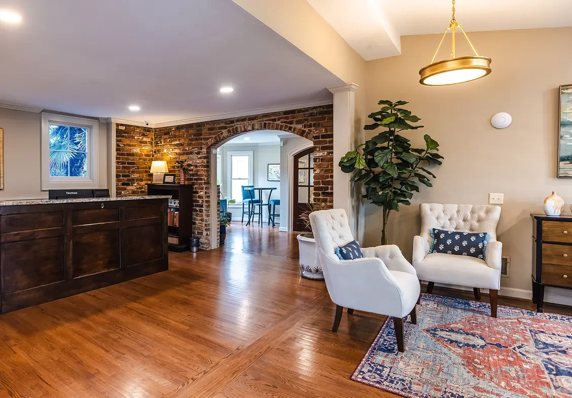 Interior of a house, showcasing a living area and an entryway