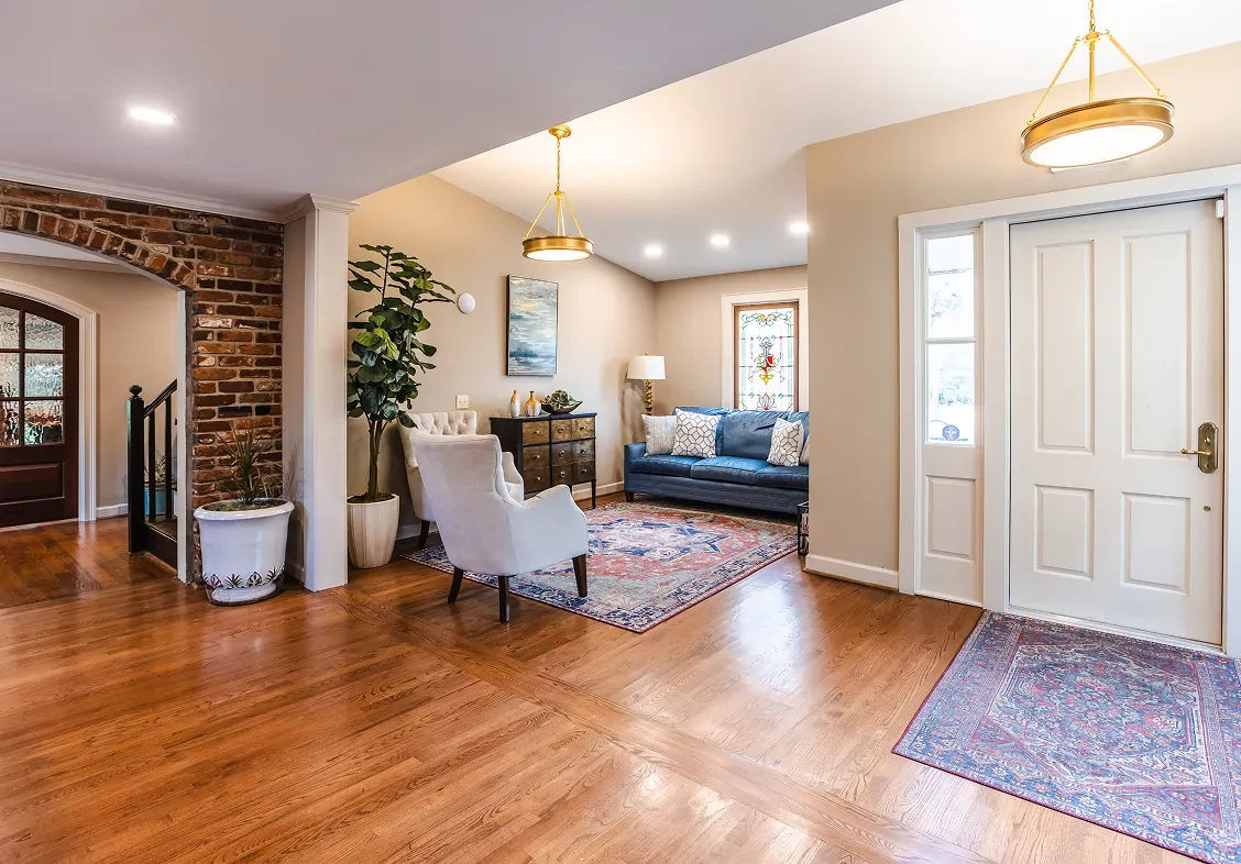 Interior of a house, showcasing a living area and an entryway